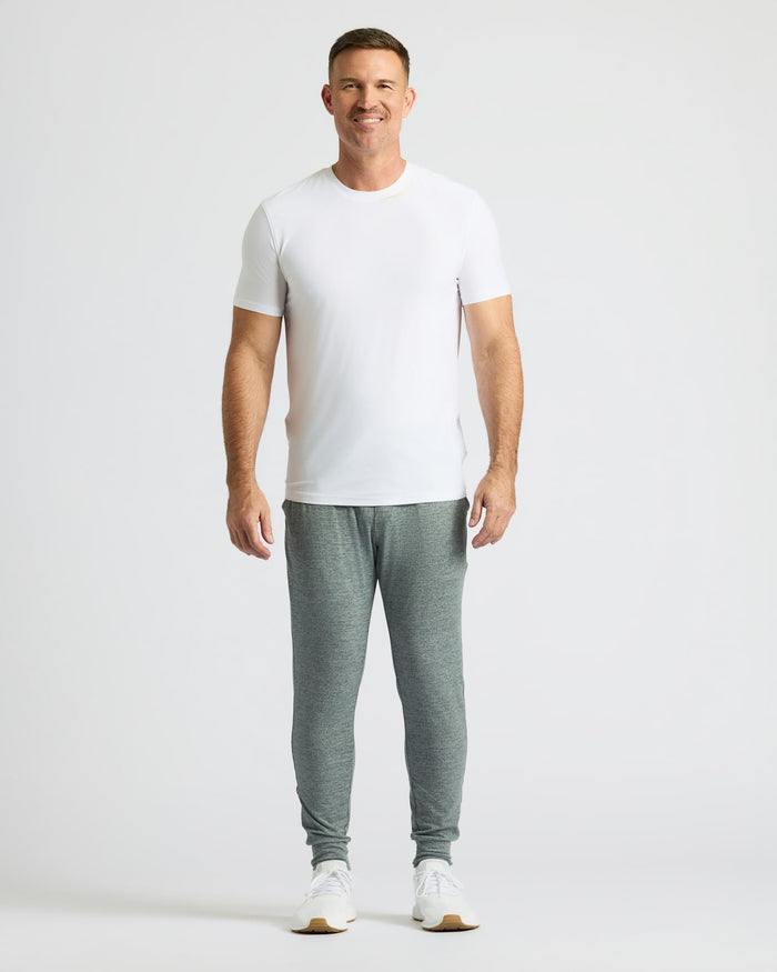 Man wearing Heather Gray Active Joggers with white t-shirt and sneakers.