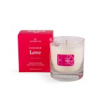 Clear glass candle with a pink label next to a red box, both featuring the text I Choose Bliss Candle | Aluminate Life, designed to evoke relaxation and wellness.