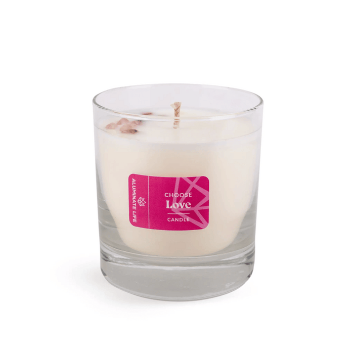 I Choose Love Candle | Aluminate Life in a clear glass container with a pink label, featuring white wax and a single wick, styled for a calming wellness atmosphere.