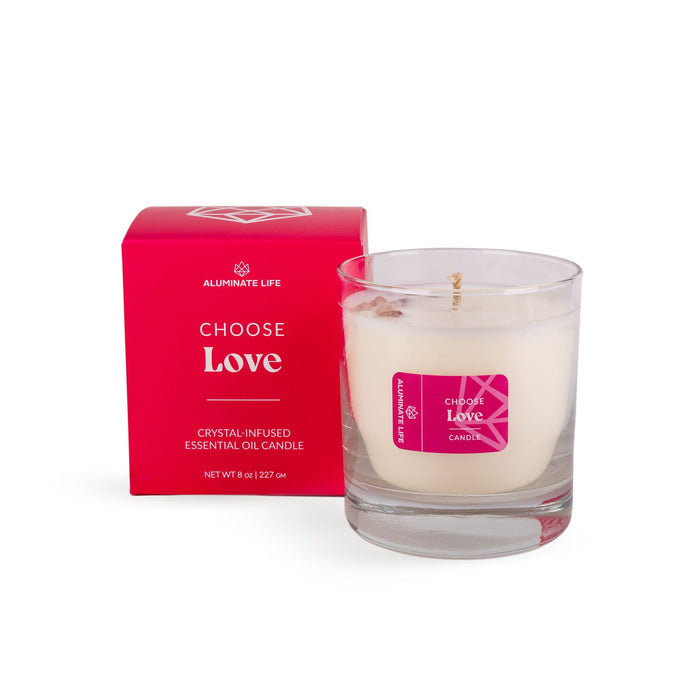 I Choose Love Candle | Aluminate Life features a crystal-infused essential oil blend in a clear glass container, paired with a vibrant red box for a soothing wellness experience.