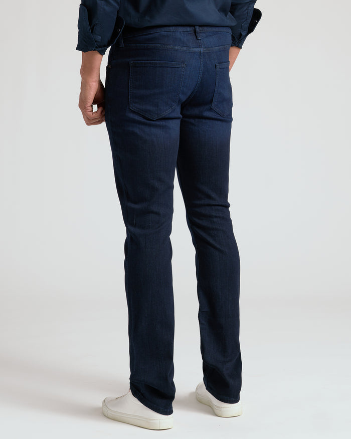 Indigo Wash Straight Comfort Stretch Jeans with patch pockets and sneakers.