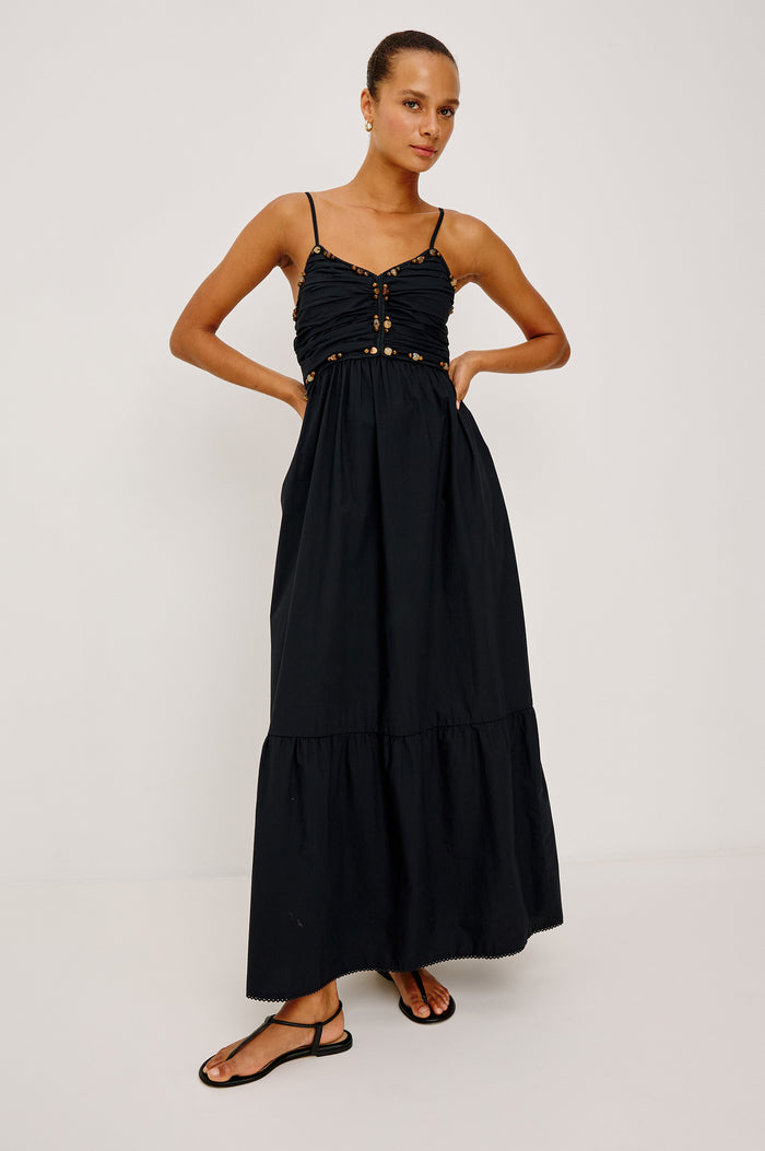 Ivana Maxi Dress in Cotton Poplin With Adjustable Spaghetti Straps, Ruched Bodice With Braided Trim and Beaded Embellishments, and Full Skirt in Black Colorway - Full Body Front View Featured on Model