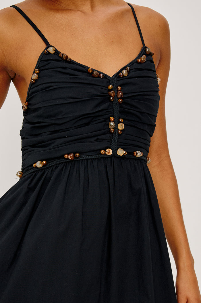 Ivana Maxi Dress in Cotton Poplin With Adjustable Spaghetti Straps, Ruched Bodice With Braided Trim and Beaded Embellishments, and Full Skirt in Black Colorway - Upper Body Front View Featured on Model