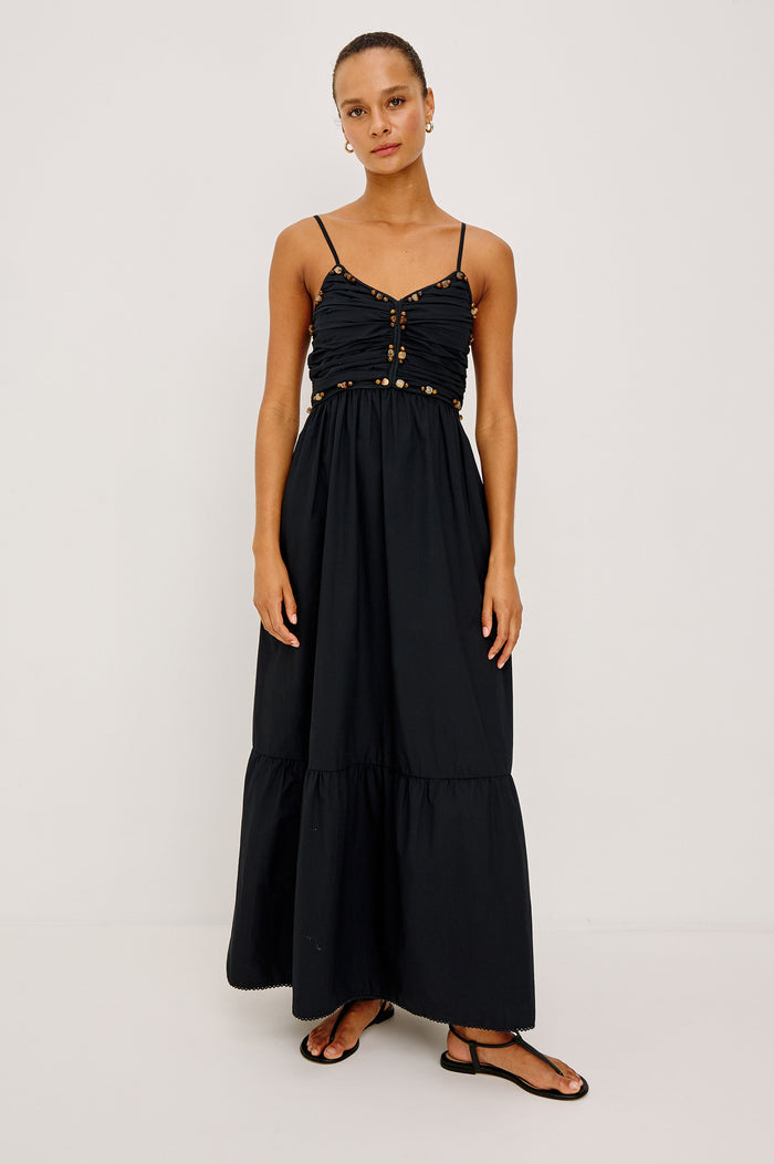 Ivana Maxi Dress in Cotton Poplin With Adjustable Spaghetti Straps, Ruched Bodice With Braided Trim and Beaded Embellishments, and Full Skirt in Black Colorway - Full Body Front View Featured on Model