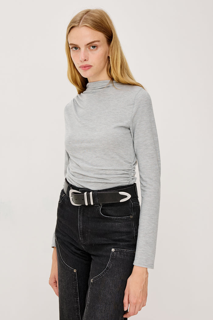 Joelle Top in Brushed Rib Jersey With Subtle Mock Neck, Fitted Silhouette, Side Shirring, and Long Sleeves in Heater Grey Colorway - Full Body Front View Featued on Model