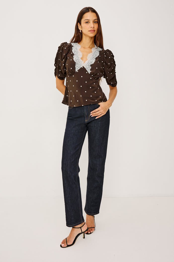 Lazara Top in Crepe With Lace Trim V-Neckline and Three-Quarter Puff Sleeves With Ruching in Cocoa Polka Dots Colorway - Full Body Front View Featured on Model