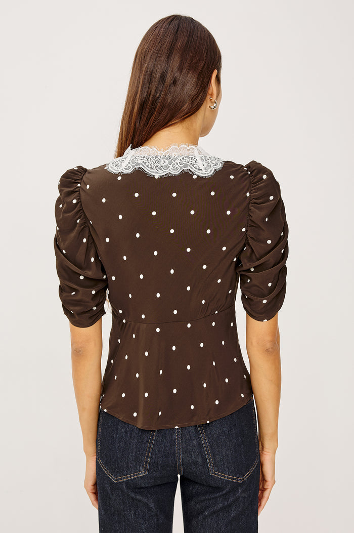 Lazara Top in Crepe With Lace Trim V-Neckline and Three-Quarter Puff Sleeves With Ruching in Cocoa Polka Dots Colorway - Upper Body Back View Featured on Model