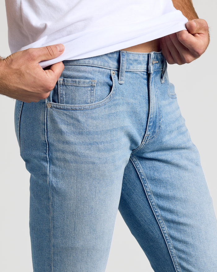 Light Indigo Wash Slim Authentic Denim Jeans with visible waistband and front pocket.