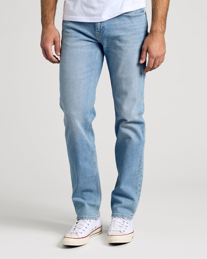 Light Indigo Wash Straight Authentic Denim Jeans with white canvas sneakers.
