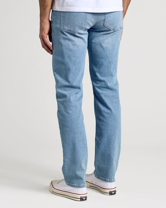 Light Indigo Wash Straight Authentic Denim Jeans with white sneakers.