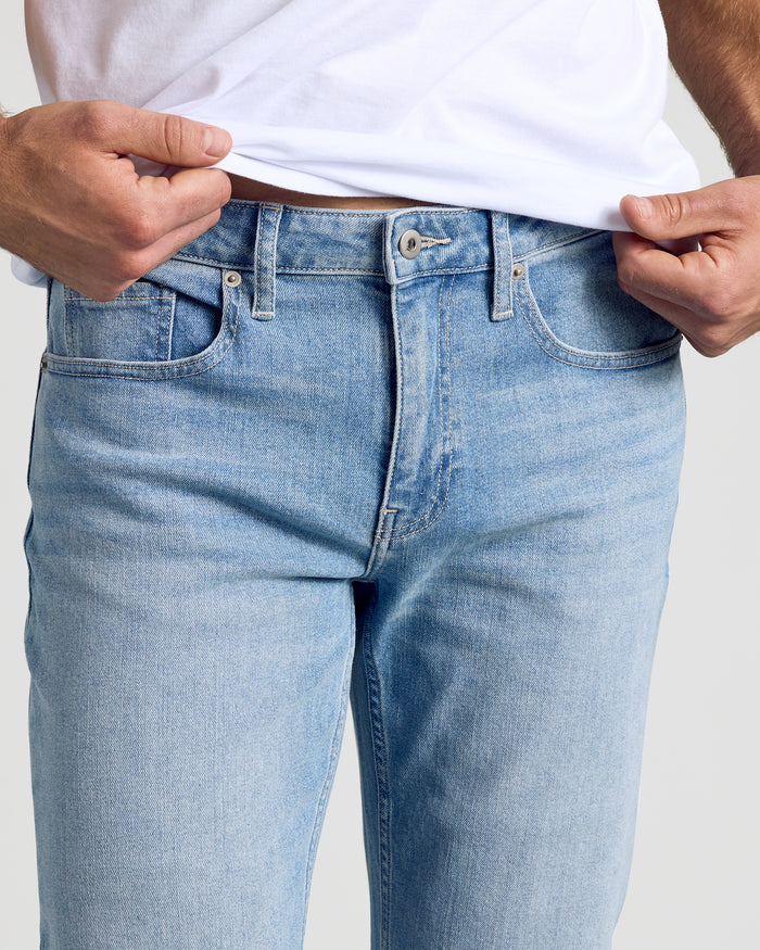 Light Indigo Wash Straight Authentic Denim Jeans with button closure and front pockets.
