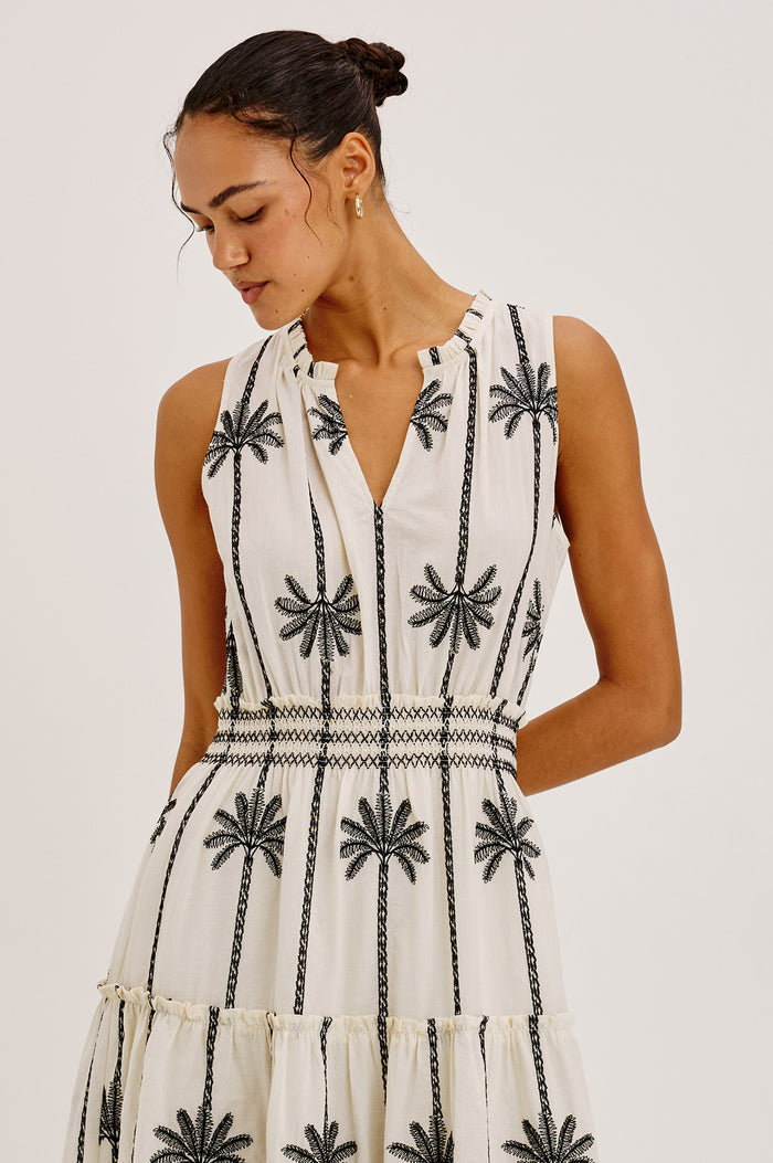 Loulou Maxi Dress in Cotton Voile With Ruffle Trim, V-Neck, Smocked Waist, and Ruffle Tier Skirt in Embroidered Palms Colorway - Upper Body Front View Featured on Model