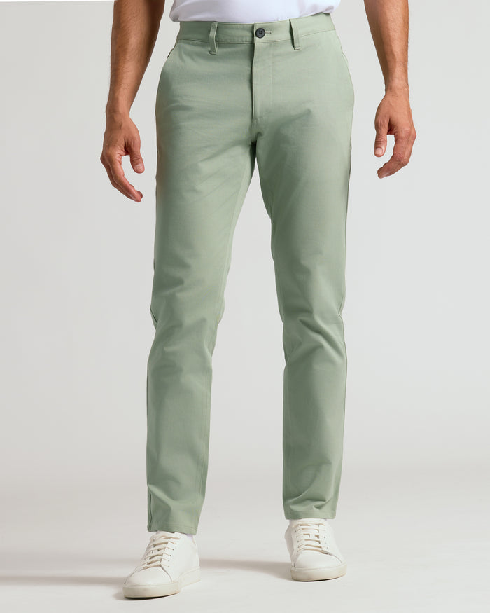 Meadow Slim Twill Chino Pant with sneakers, showing structured, stretch fit.