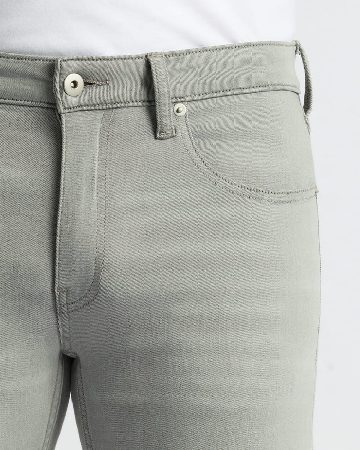 Medium Gray Wash Slim Comfort Stretch Jeans with button closure and belt loops.
