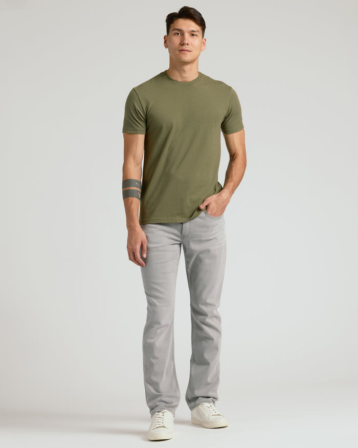 Man wearing Medium Gray Wash Straight Comfort Stretch Jeans, casual style.