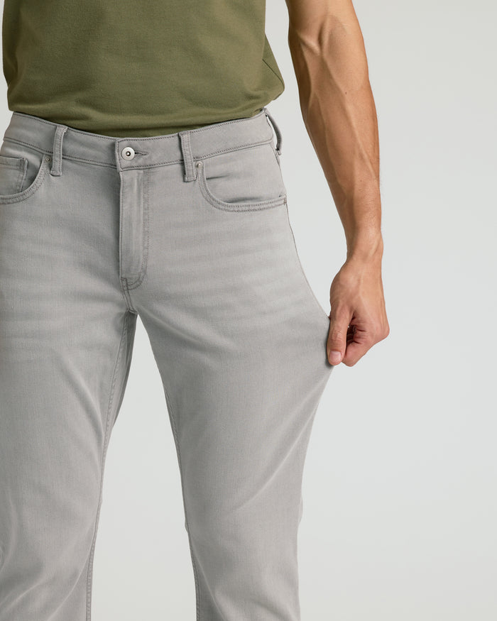 Medium Gray Wash Straight Comfort Stretch Jeans being pulled to show stretch.