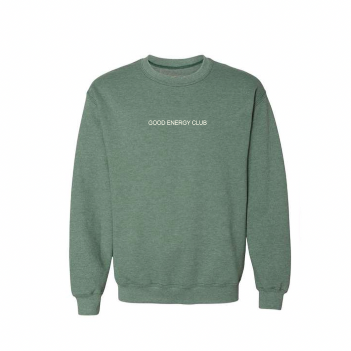 Green crew neck sweatshirt with "GOOD ENERGY CLUB" text on front, showcasing Mentally I’m At The Spa Unisex Crew Neck Sweatshirt | Lucky Owl for casual wellness-inspired style.