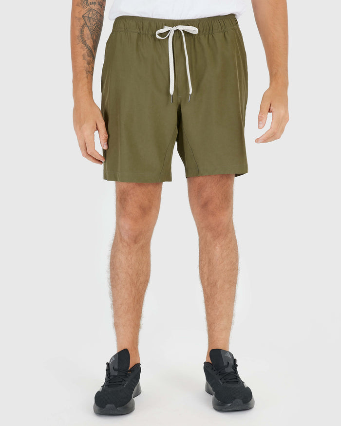 Military Green Active Quick Dry Shorts with Liner, shown on man with tattoo.