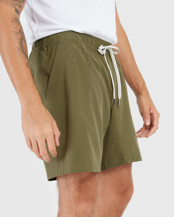 Man wearing Military Green Active Quick Dry Shorts with Liner.