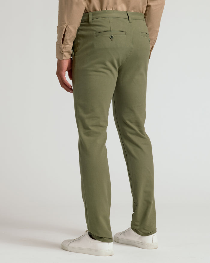 Military Green Slim Chino Pants 2.0 with white sneakers.