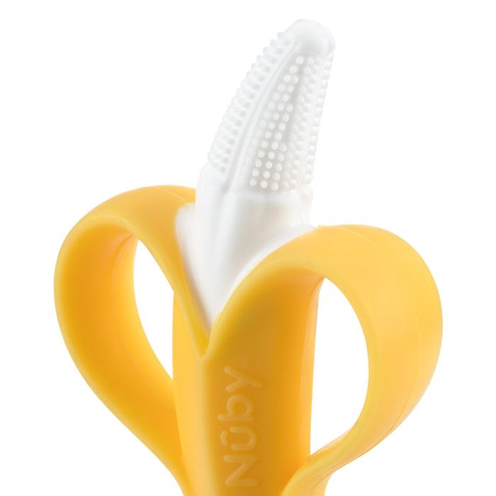 The Nuby NanaNubs Gum Massager and Carrot Teether Set features a banana-shaped, white-bristled baby toothbrush with yellow handles and doubles as a silicone teether. The Nuby logo appears on the handle.