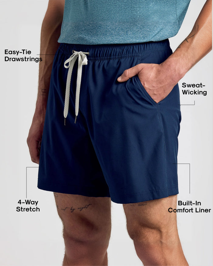 Navy Active Quick Dry Shorts with Liner, featuring drawstrings and sweat-wicking fabric.