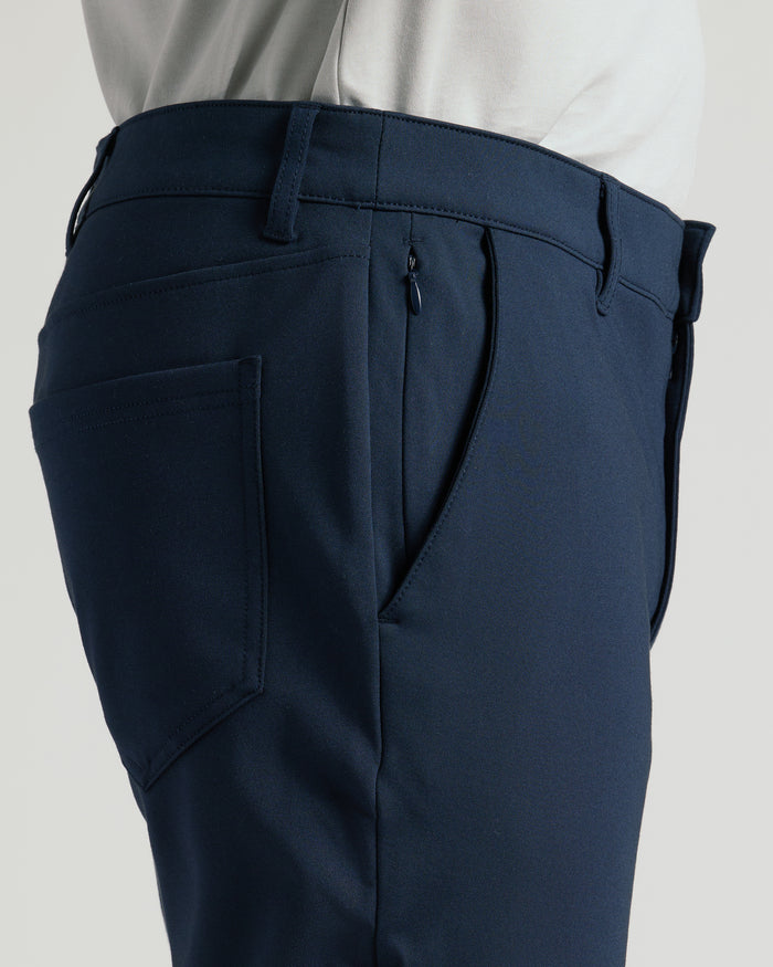 Navy Commuter Pants with slanted and patch pockets, tucked-in shirt.