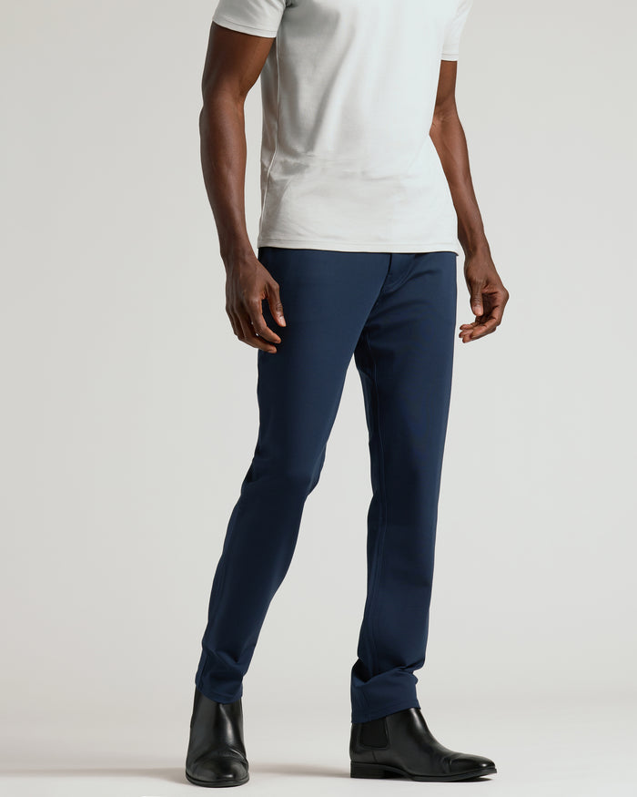 Navy Commuter Pants with slim fit, worn with black Chelsea boots.