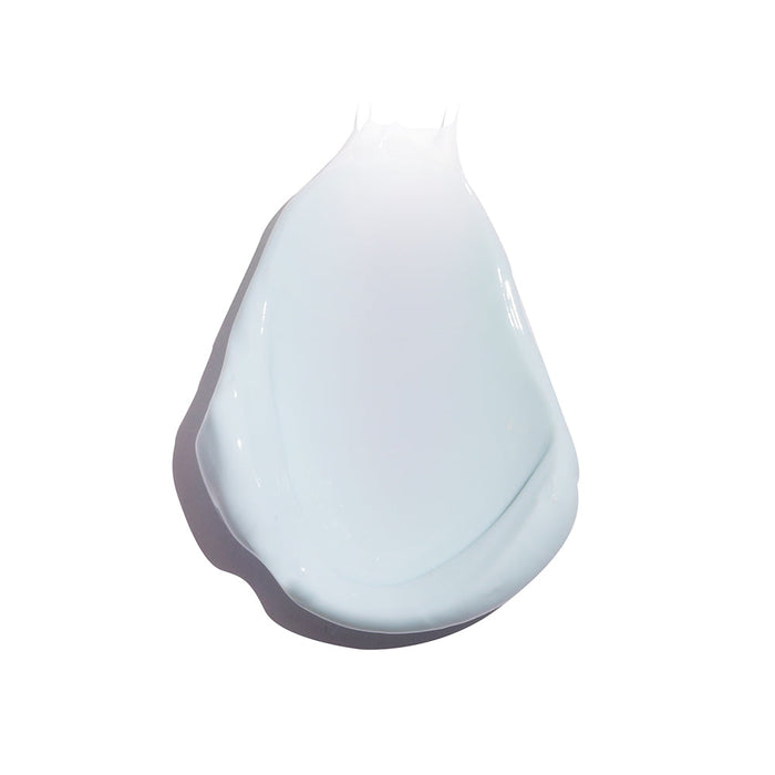 Smooth, light blue cream texture representing Refreshing Water Cream Organic Face Sunscreen SPF 50 | COOLA, showcasing skincare product consistency and hydration benefits.