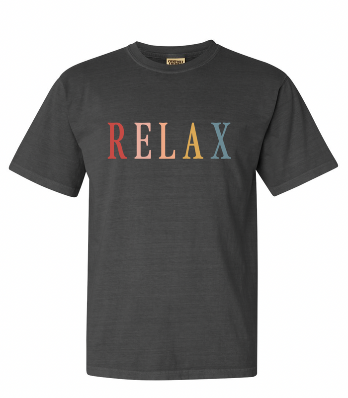 Black crew neck t-shirt with the word RELAX in multicolored retro-style letters across the chest, featuring the product title RELAX Retro Unisex T-Shirt | Lucky Owl.