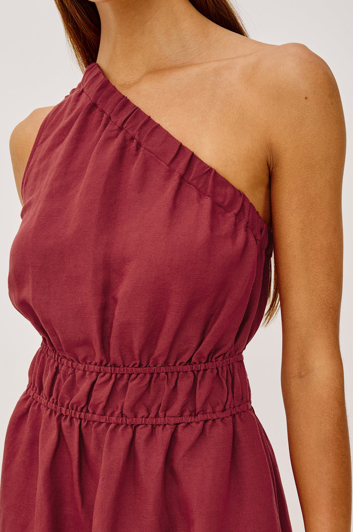 Selani Midi Dress in Linen-Viscose Blend With One-Shoulder Neckline, Laddered Elastic Waist, Side Slits, Side Pockets, and Softly Voluminous Skirt in Spice Colorway - Upper Body Front View Featured on Model