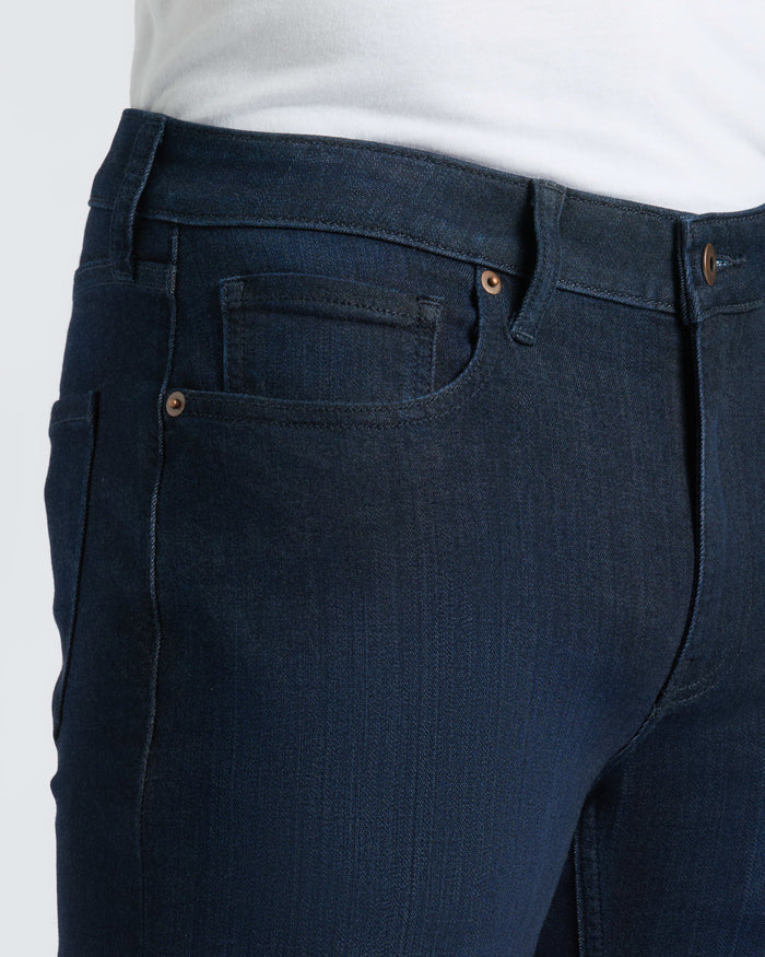 Medium Gray Wash Slim Comfort Stretch Jeans with tucked-in white T-shirt.