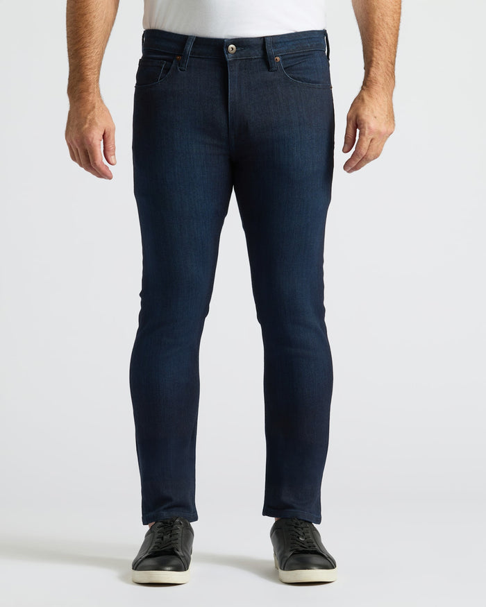 Slim Indigo and Medium Wash Comfort Stretch Jeans showcased with black sneakers.