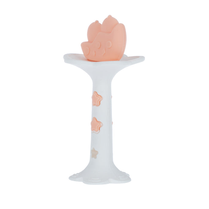 The Wand and Tuba Teether Set in Coral & Aqua features a white silicone teether with a pink crown-shaped top and star accents, standing upright to provide gentle relief for your little one.