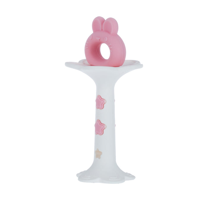 The Wand and Tuba Teether Set | Pink & Yellow features a white pacifier holder with pink and beige stars, topped with a bunny ring, and doubles as a silicone teether for gentle teething relief.